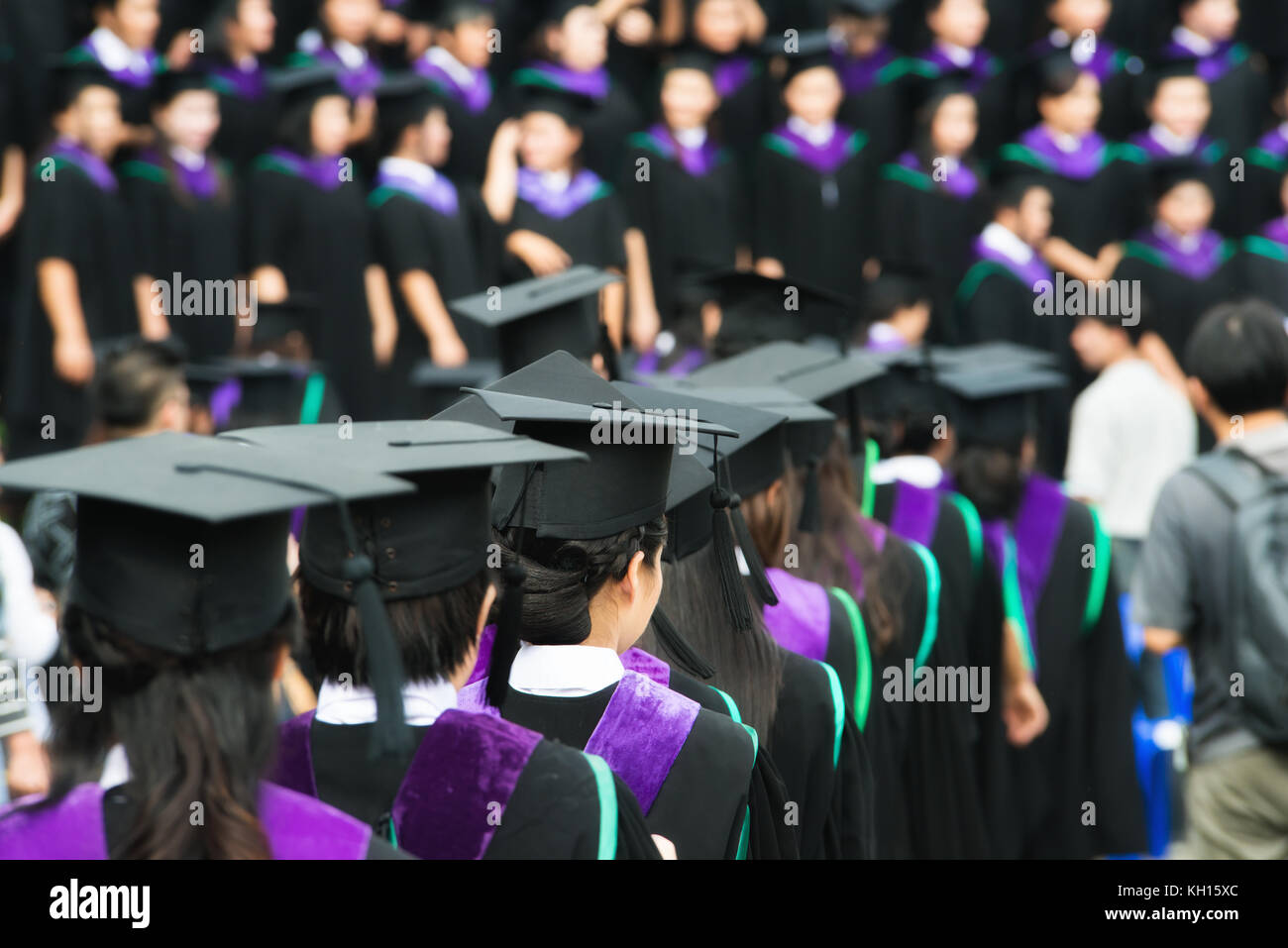 Back of graduates during commencement at university. Close up at graduate cap Stock Photo