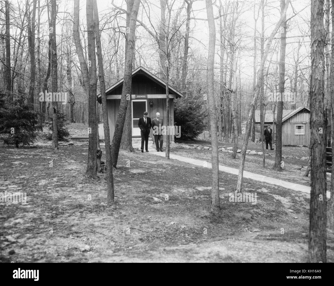 President John F. Kennedy (left center) seeks advice from former President Dwight D. Eisenhower regarding the Cuban Missile Crisis, Camp David, MD, 4/22/61. Photo by Abbie Rowe. Stock Photo