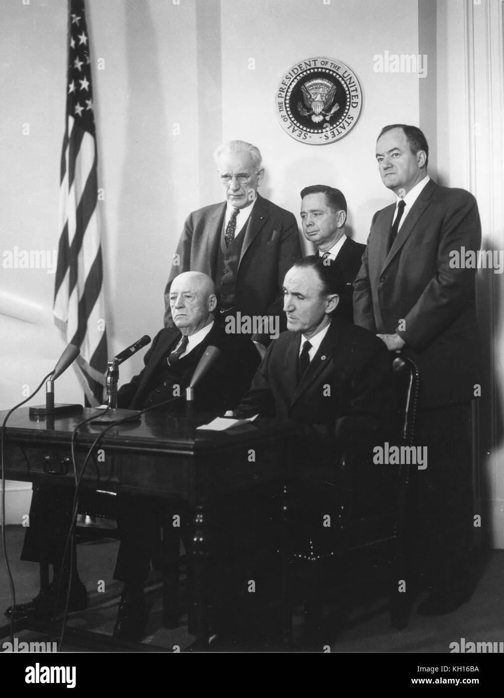 Democratic Leaders  of the 87th Congress pose under the Presidential Seal; seated l-r: Sam Rayburn, Speaker of the House; Mike Mansfield, Senate Majority Leader; standing l-r: John W McCormack, House Majority Leader; Carl B Albert, House Majority Whip; and Hubert Humphrey, Senate Majority Whip, Washington, DC, March 21, 1961. Photo by Abbie Rowe Stock Photo