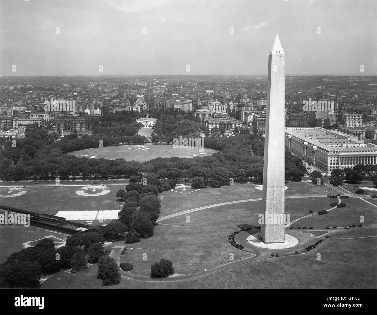 Aerial view of the Washington Monument, the Commerce Department (center) and the Tidal Basin (upper right background) before construction of the Jefferson Memorial, as taken from a US Army Air Corps aircraft, Washington, DC, 03/12/1932. Stock Photo