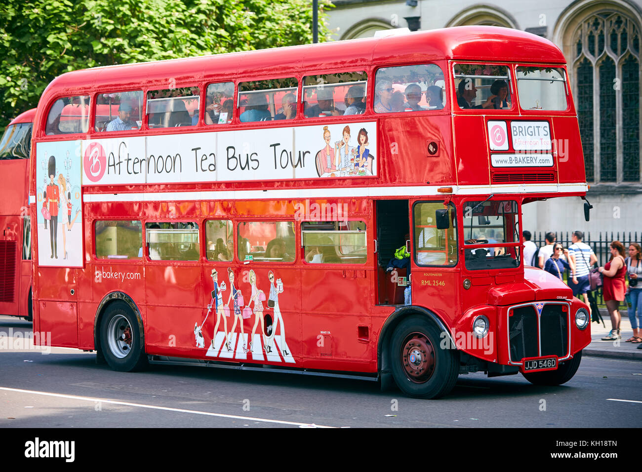 A red Routemaster bus in London providing afternoon tea bus tours by Brigit’s Bakery. Stock Photo