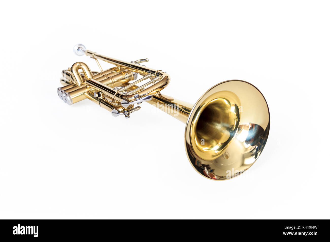 A gold lacquered Bb trumpet against a white background Stock Photo