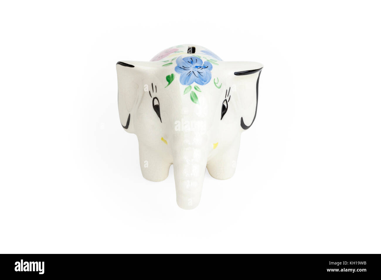 A glazed ceramic elephant money box against a white background Stock