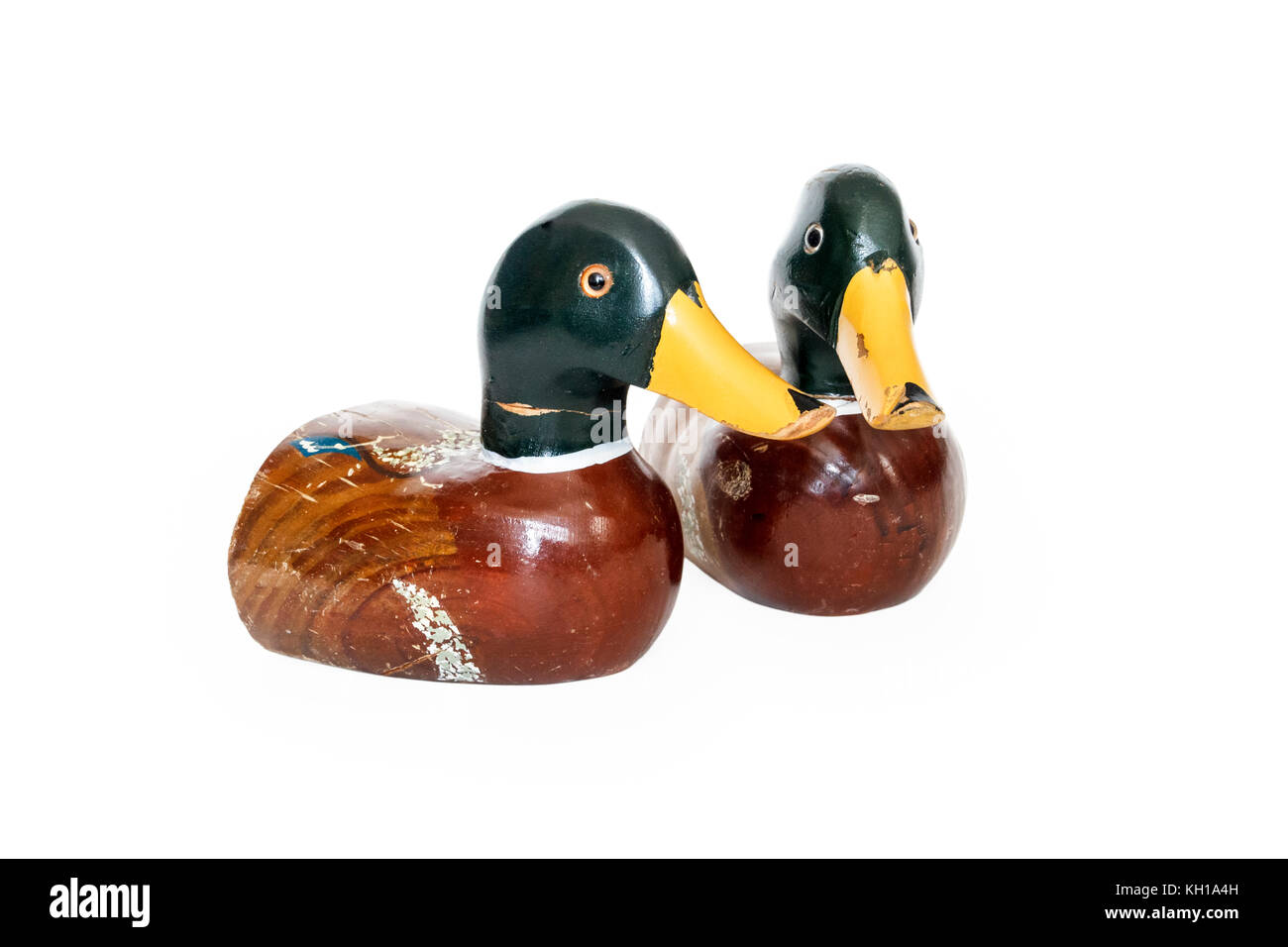 A pair of vintage hand-carved wooden Mallard duck bookends aginst a white  background Stock Photo - Alamy