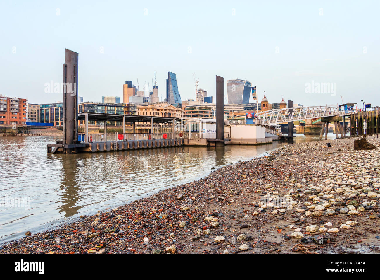 Bankside Pier, London, UK, seen from the Thames foreshore at low tide on an autumn evening Stock Photo
