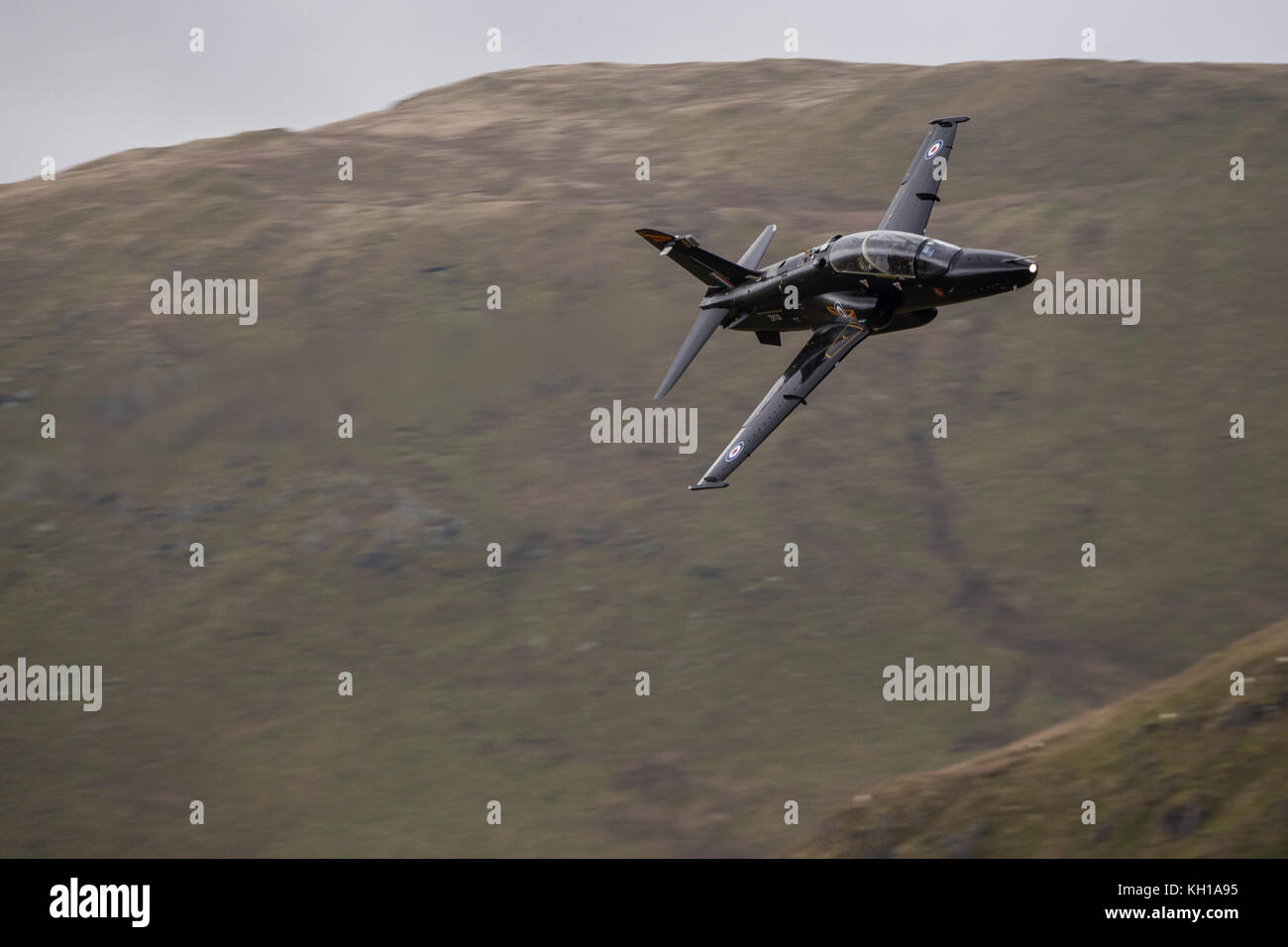 Royal Air Force Hawk T2 aircraft conducting low flying training through Snowdonia National Park in Wales. Stock Photo