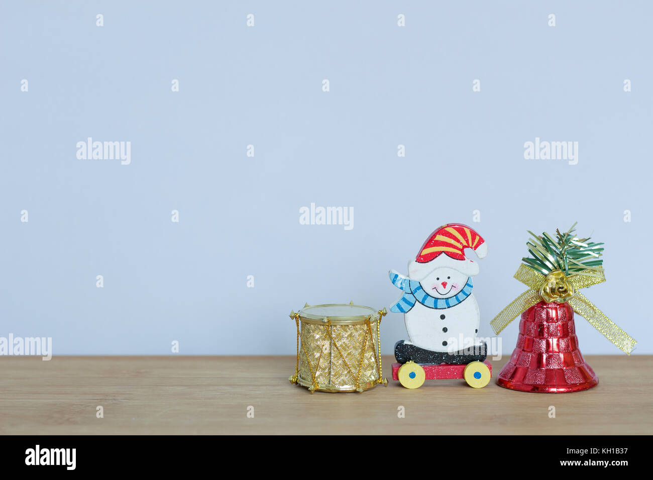 little christmas themed toy with snowman, teddy bear, ball and red bells Stock Photo