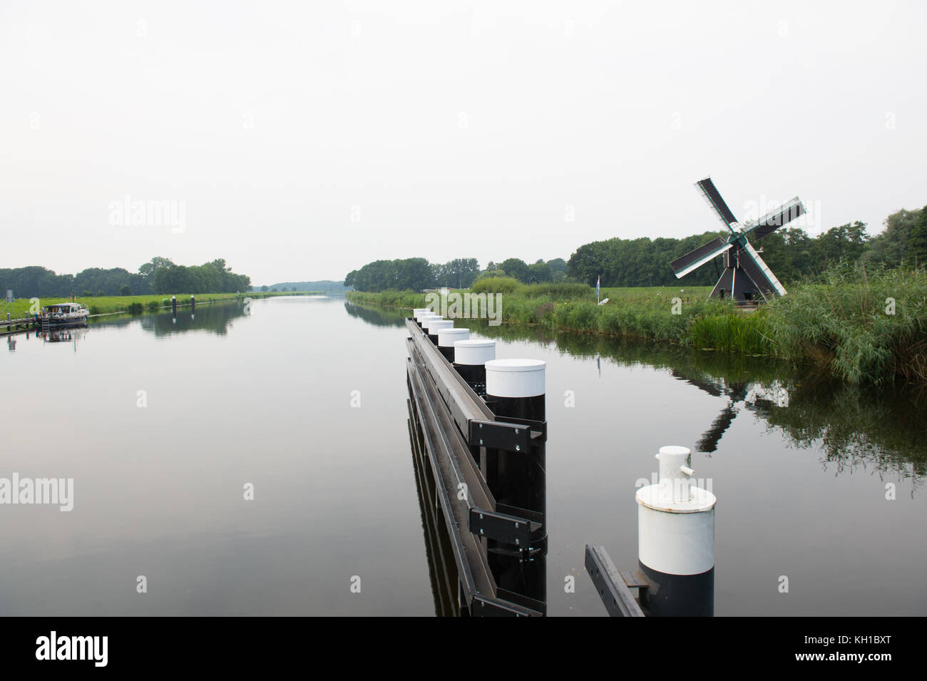 Dutch windmill at the river the IJssel in Laag-Keppel Stock Photo