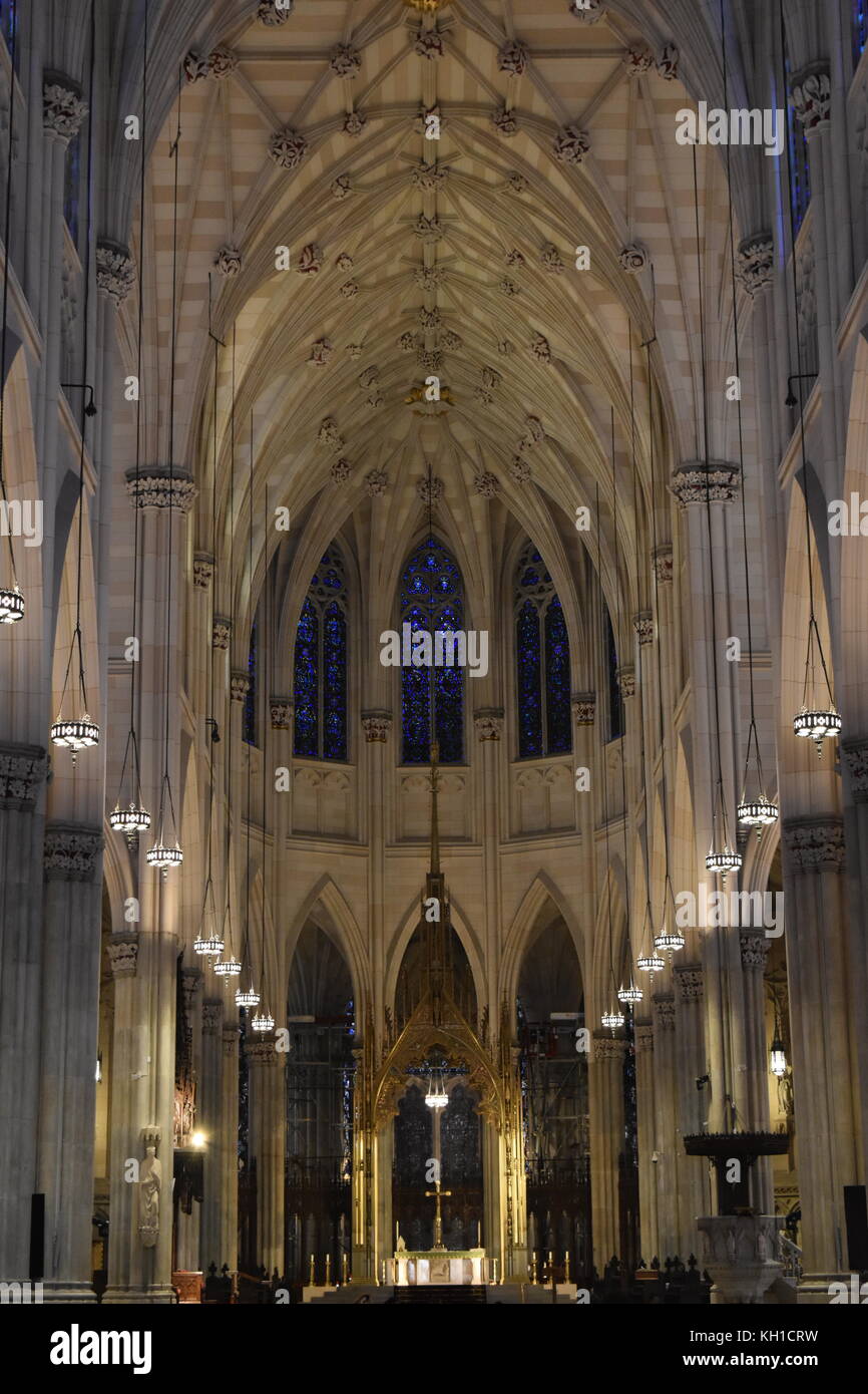 Interior roof of St Patrick's Cathedral and stained glass windows, New York City Stock Photo