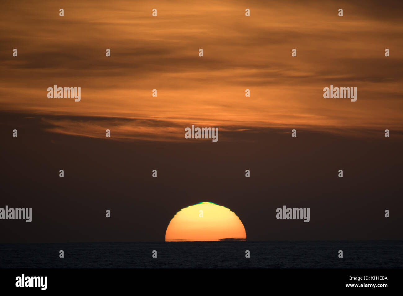 A green flash sunset off the southern coast of Staten Island or Isla de los Estados, Argentina Stock Photo