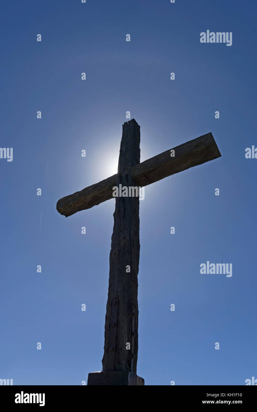 Cross with divine sun and blue sky Stock Photo