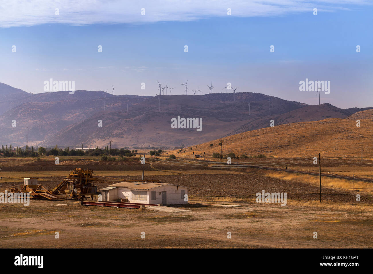 high hill landscape with wind turbines power energy for life Stock Photo