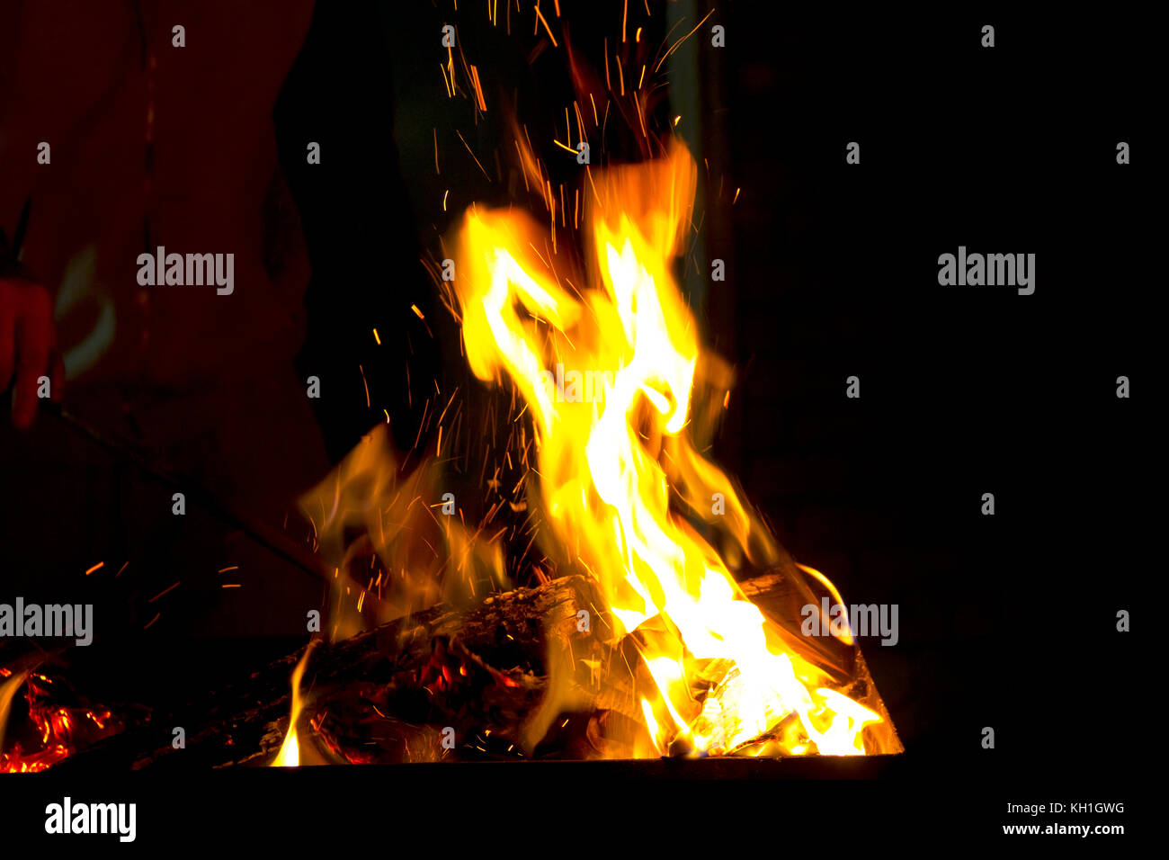 Photo of red fire flame on black background Stock Photo - Alamy