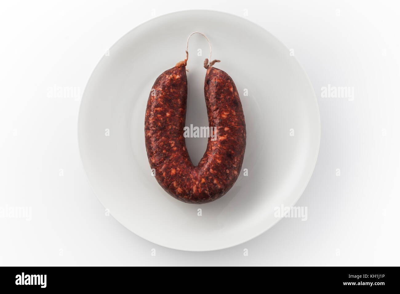 View of sausage on a white plate Stock Photo