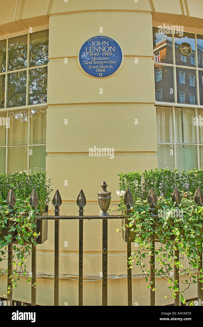 Circular blue plaque on a building façade in London highlighting John Lennon lived in the building for a short period Stock Photo