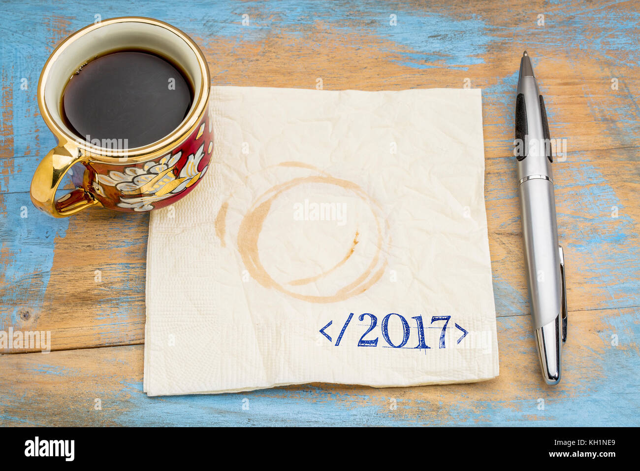 closing 2017 year concept - handwriting on a napkin in programming syntax  with a cup of espresso coffee Stock Photo