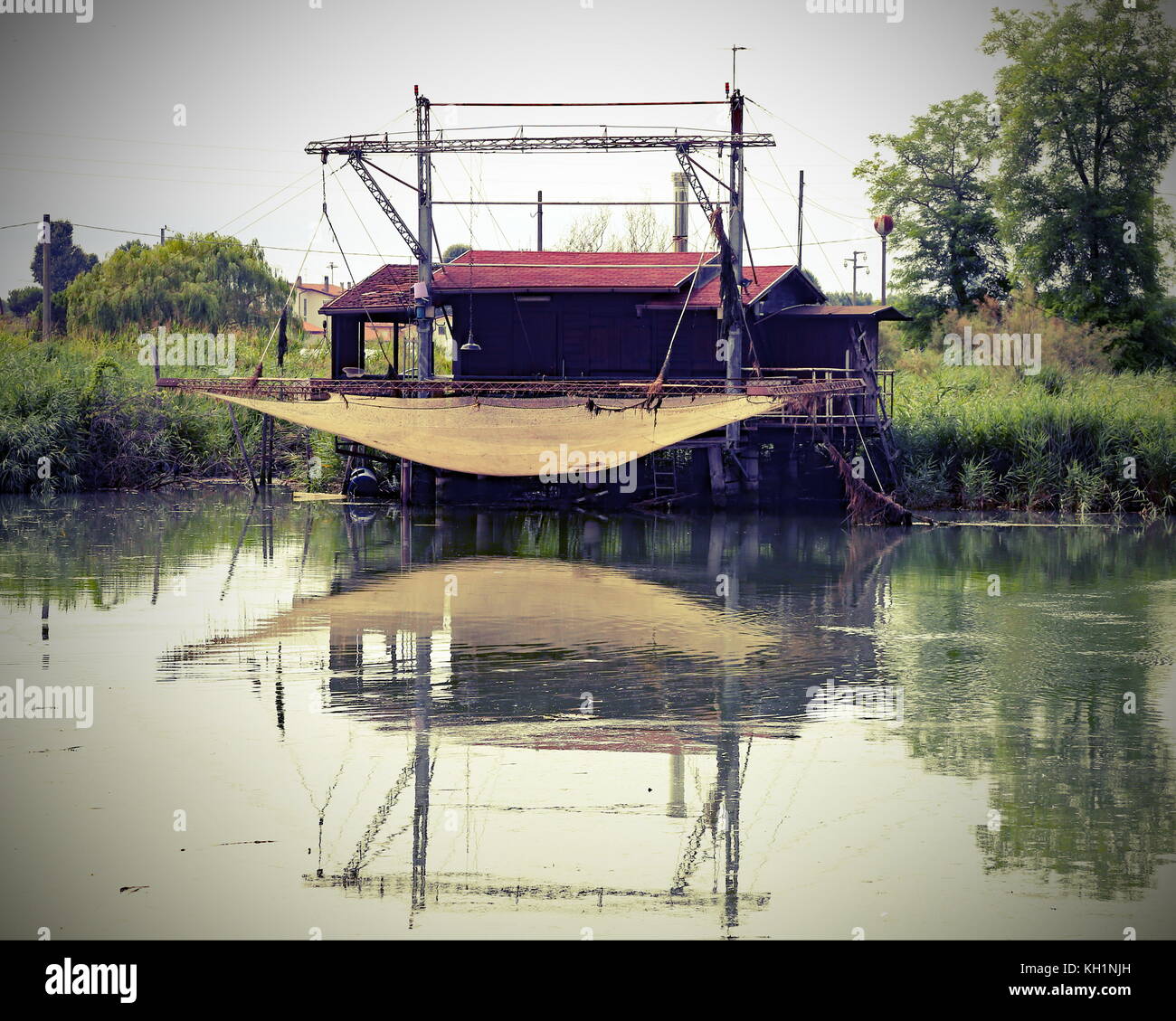Special stilts houses with fishing nets for fishing on the river with  vintage effect Stock Photo - Alamy