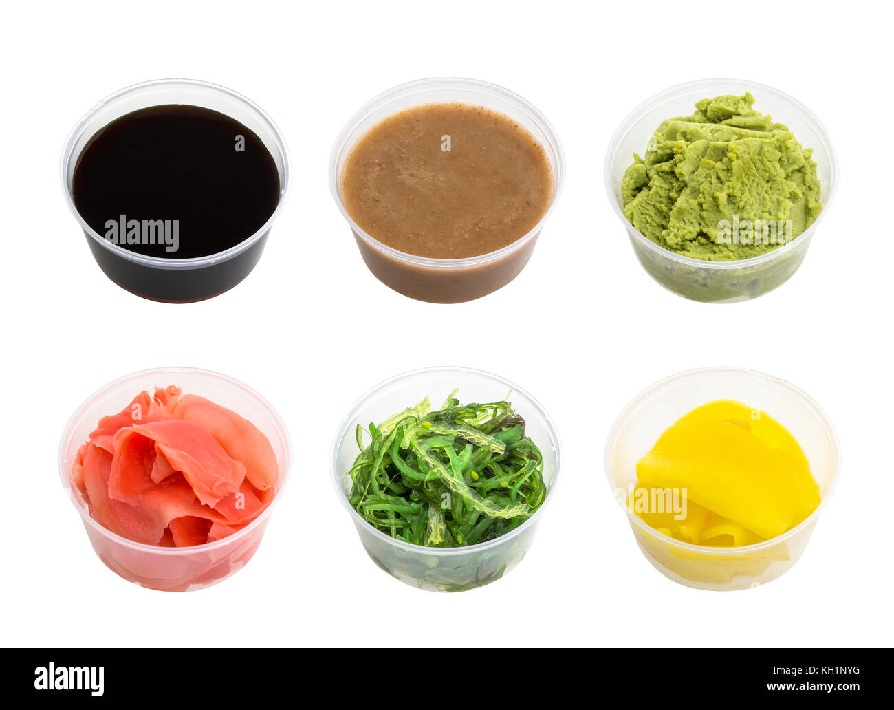 Soy sauce, wasabi, pickled ginger, Chuka, sesame sauce and pickled radishes in small bowl isolated on white background Stock Photo