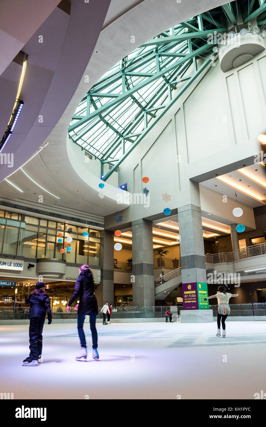 public skating in the underground ice rink at Atrium 1000, Montreal, QC, Canada Stock Photo Alamy