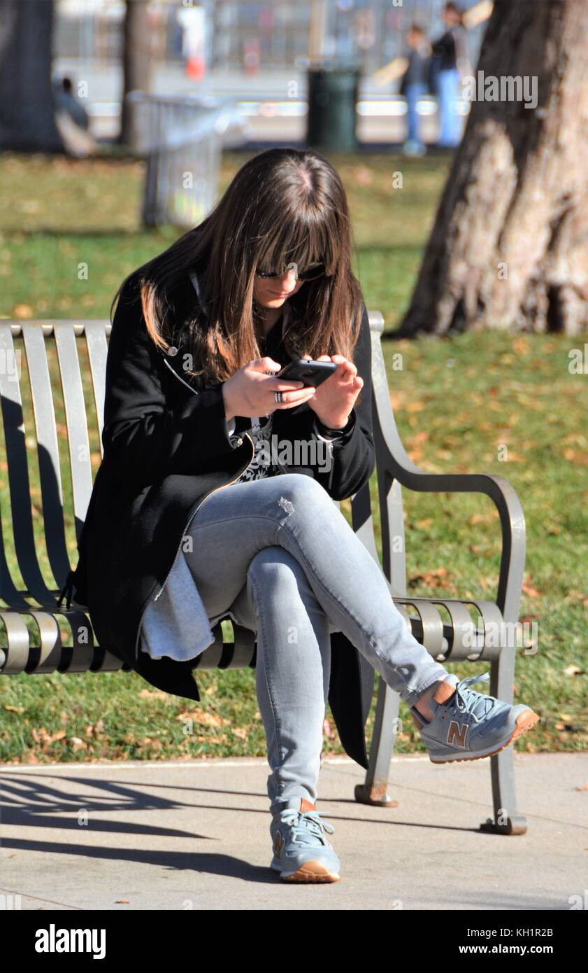 Unidentified people texting and using their cellphone cameras Stock Photo