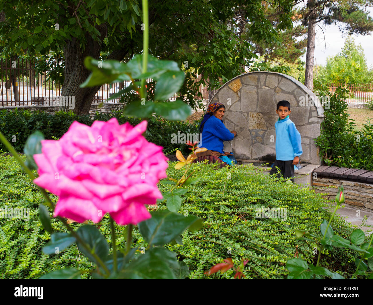 Bulgarian local villagers coming to take water from the Uzundzhovo Church's fountain. Stock Photo