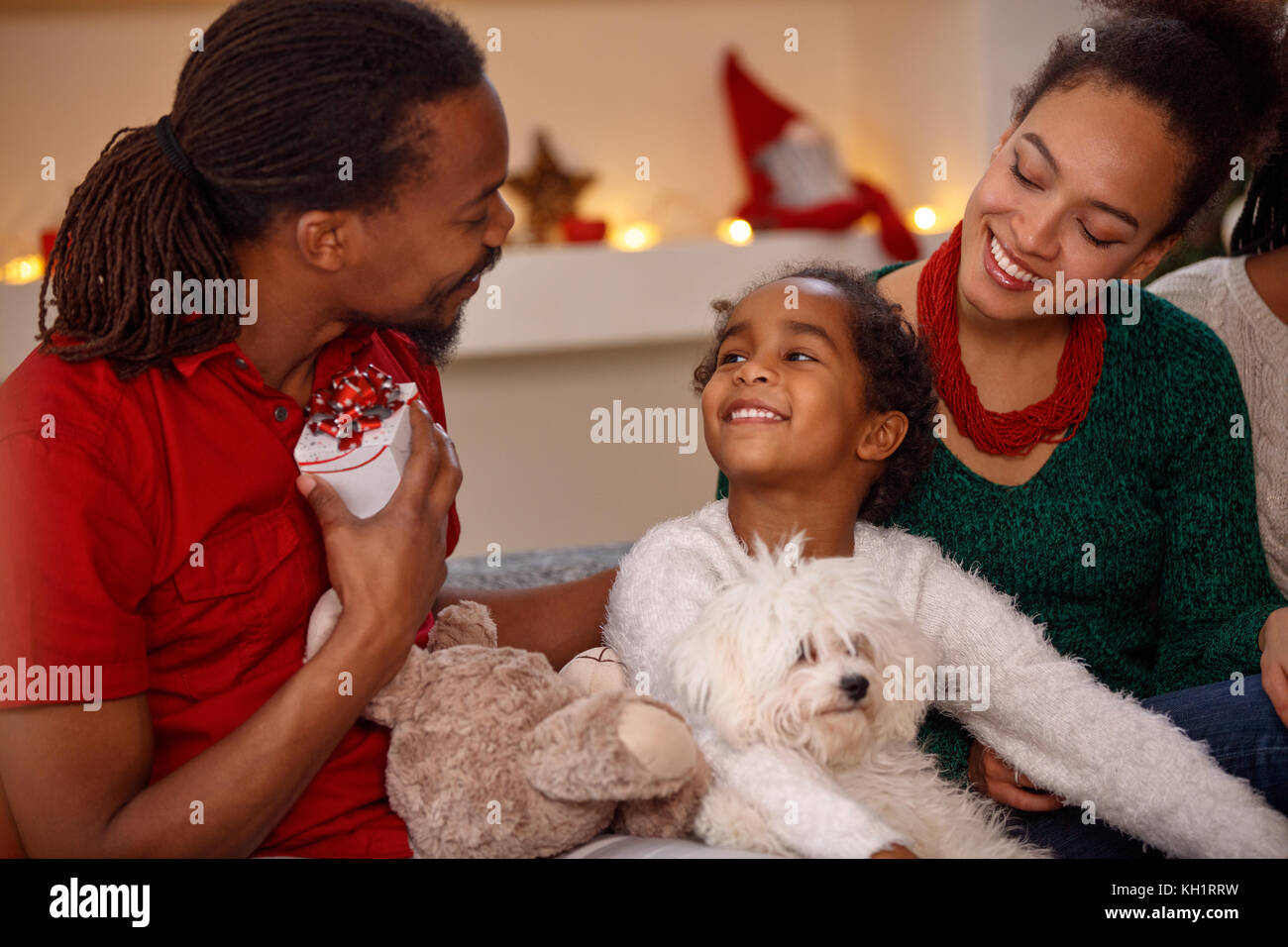 Young afro American family with presents together for Christmas Stock Photo