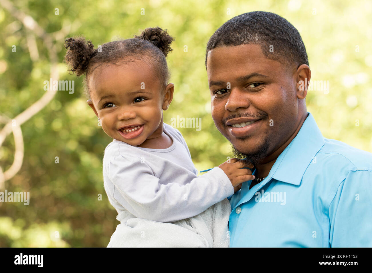 Portrait of a happy African American family Stock Photo - Alamy