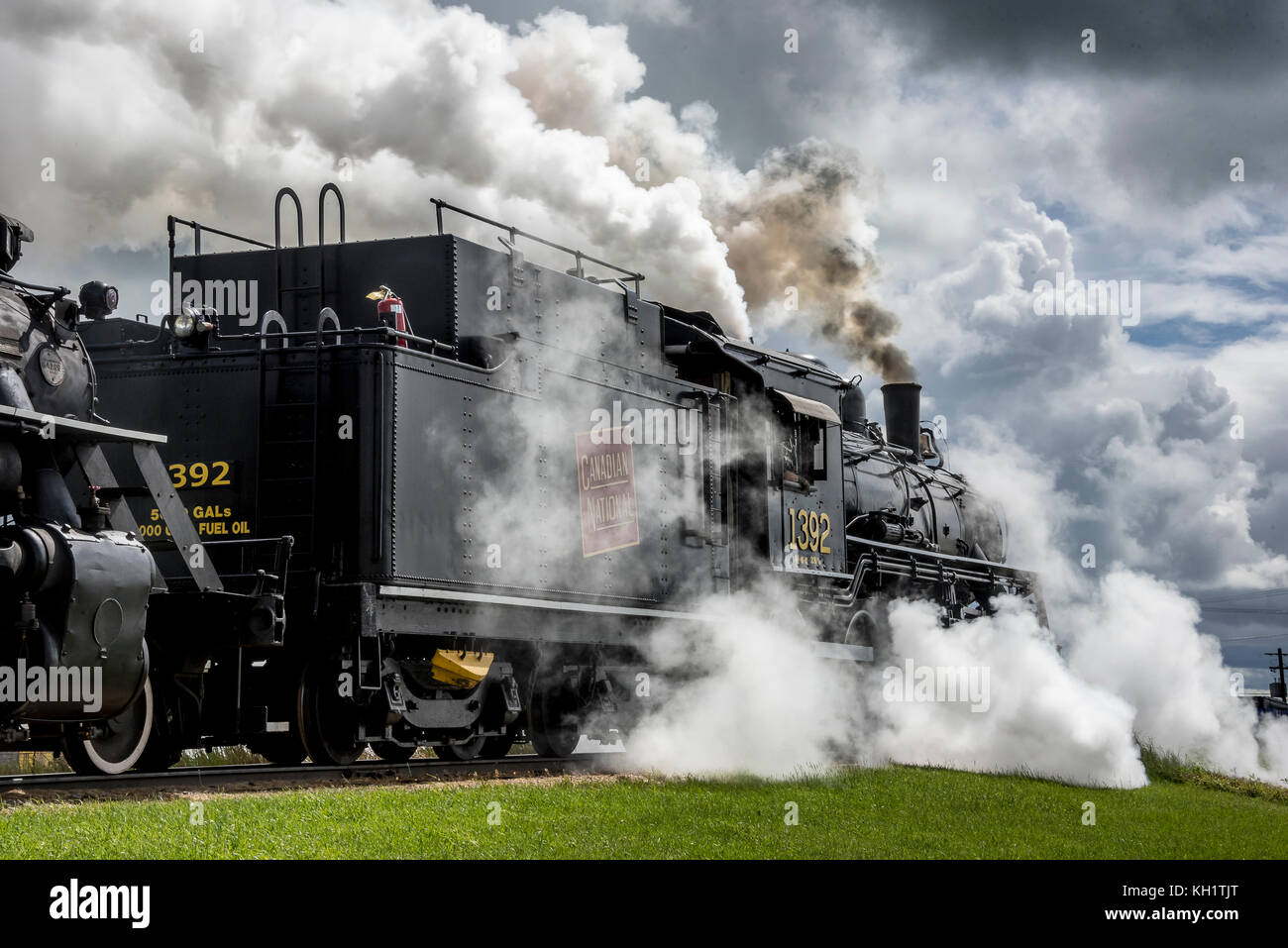 Alberta Railway Museum steam loco 1392 and Alberta Prairie 41 blow down on departing Stettler Stock Photo