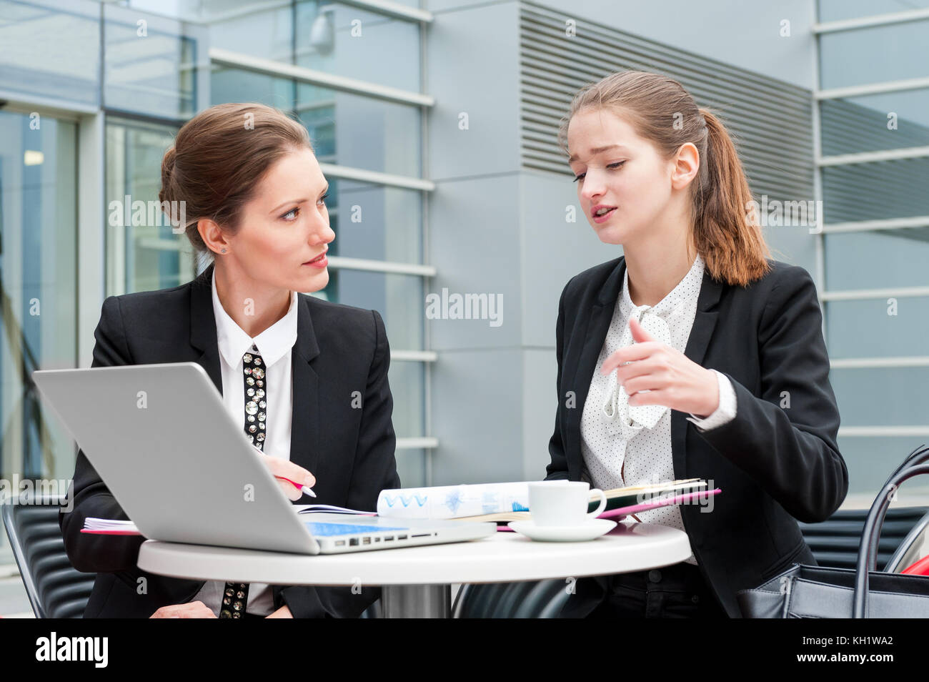 Two young business women Stock Photo