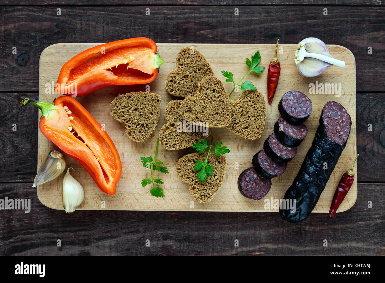 Morcillo (Spanish black pudding, blood sausage), cutting slices, black