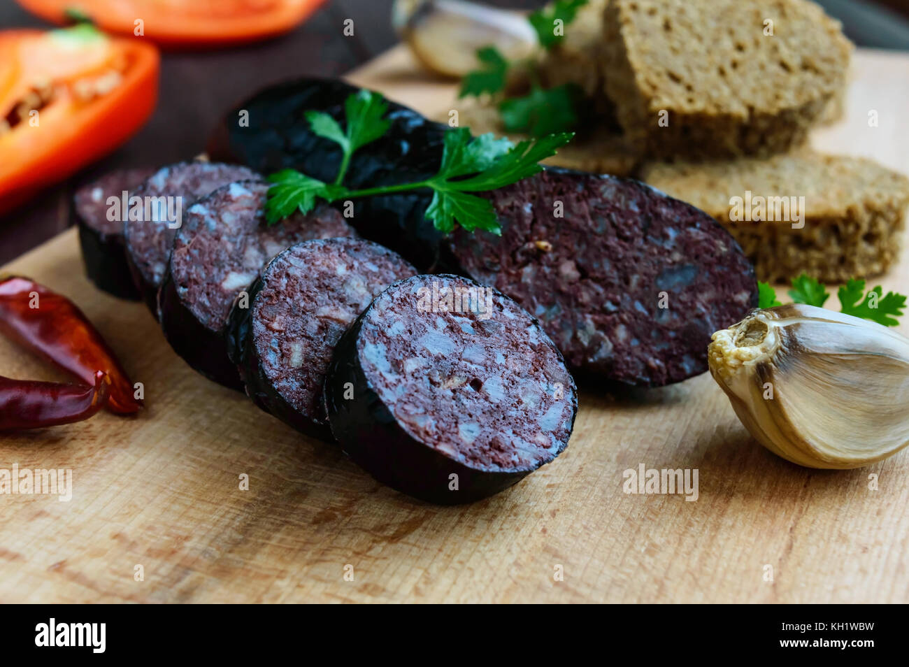 Morcillo Spanish Black Pudding Blood Sausage Cutting Slices Black Rye Bread In A Heart Shape Pepper Garlic On A Wooden Board Close Up A Festi Stock Photo Alamy