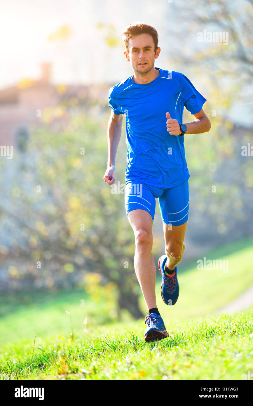 Professional mountain running athlete in training Stock Photo Alamy