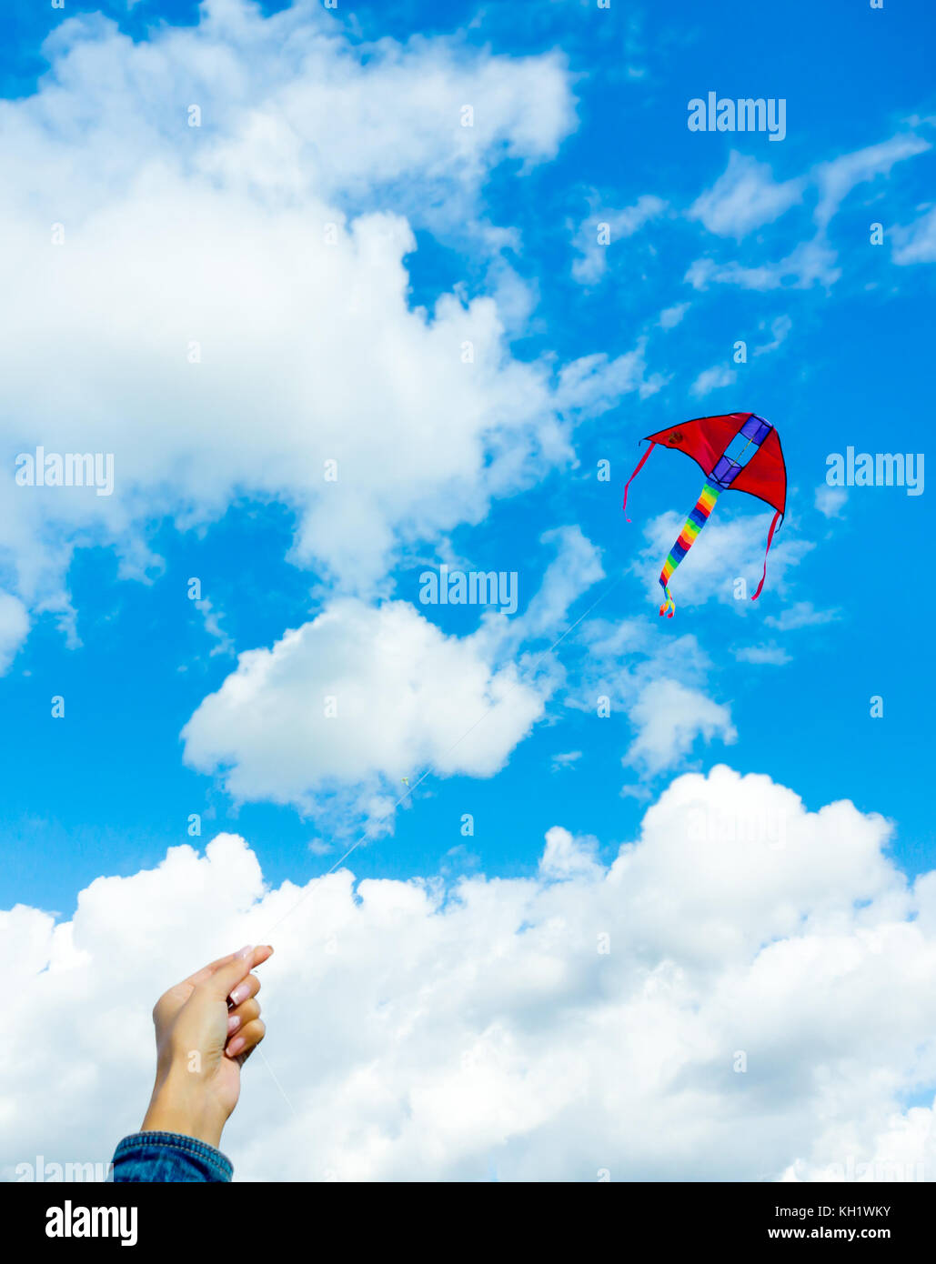Hands holding kite Stock Photo - Alamy