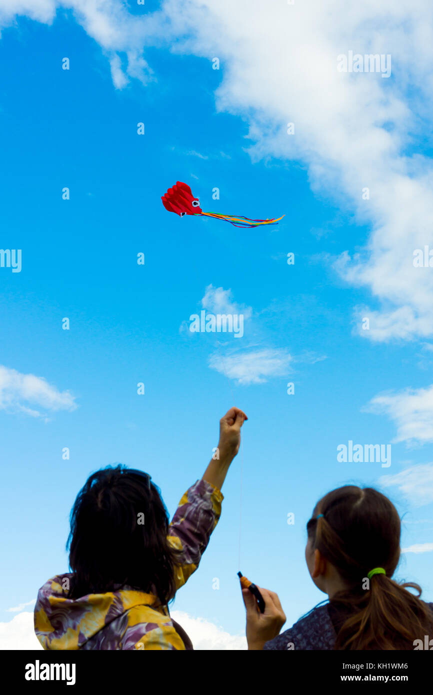 Hands holding kite Stock Photo - Alamy