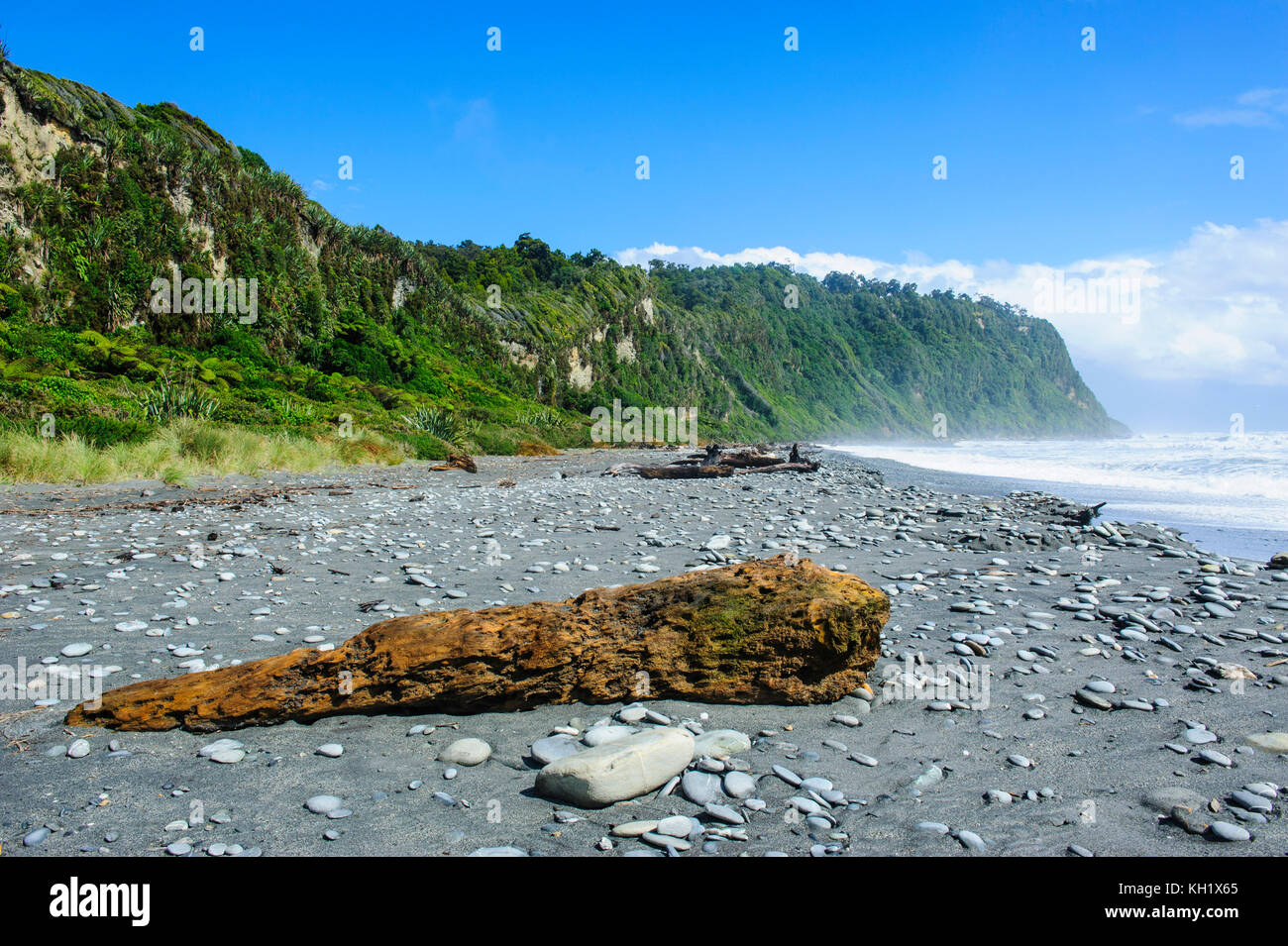 Grey rocky beach in Okarito along the road between Fox Glacier and Greymouth, South Island, New Zealand Stock Photo