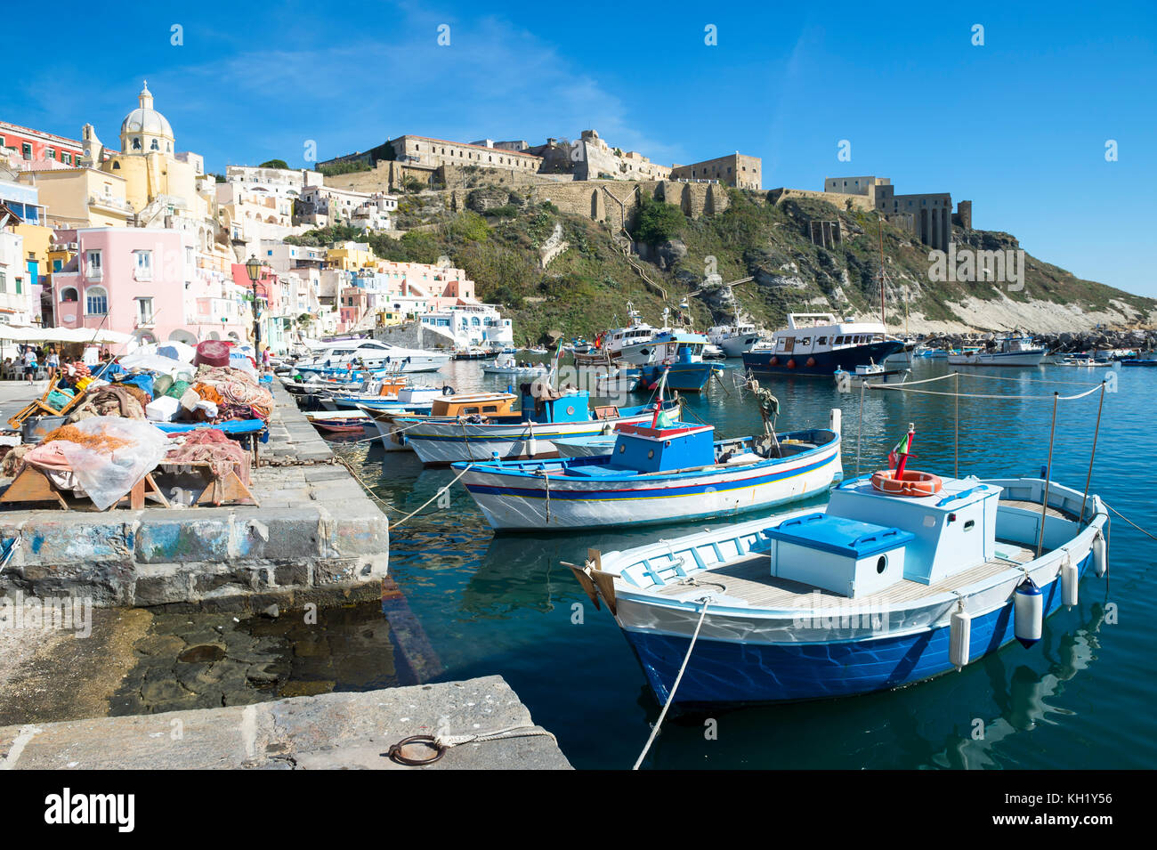 Beautiful view of traditional fishing boats moored in Corricella harbour on the island of Procida, Italy. Stock Photo