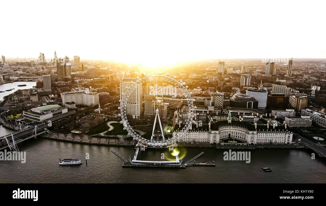 Aerial View of the Iconic Landmark Riverside London Eye Observation Wheel at Dawn Time with Sunrise in Central City of London Stock Photo