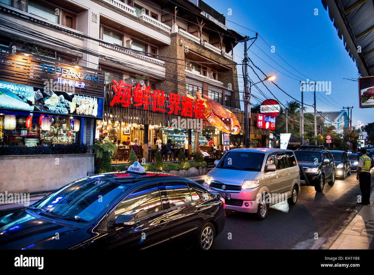 Bali, Indonesia - July 04, 2017. A Street view in Kuta. Restaurants houses and traffic on the scene. Stock Photo