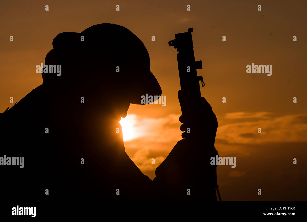 A view of Tommy, a statue of a First World War soldier by artist&Ecirc;Ray Lonsdale, as the sun rises in Seaham on Remembrance Sunday. Stock Photo
