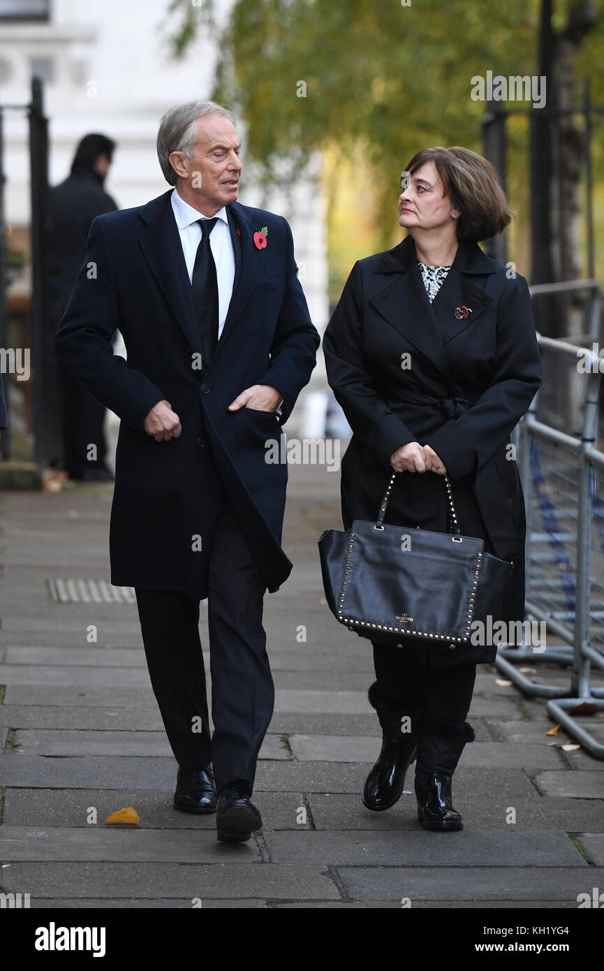 Former Prime Minister Tony Blair and his wife Cherie walk through