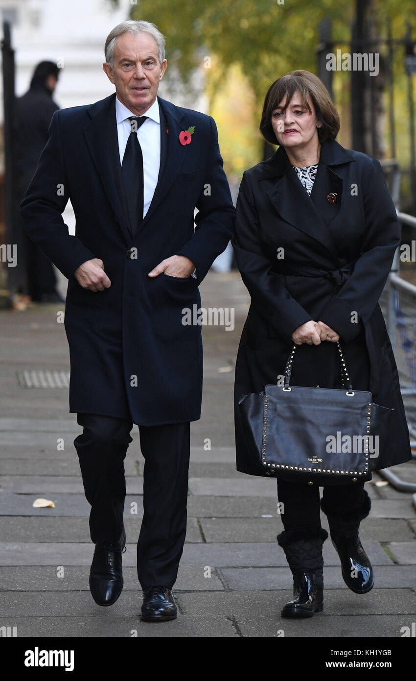 Former Prime Minister Tony Blair and his wife Cherie walk through