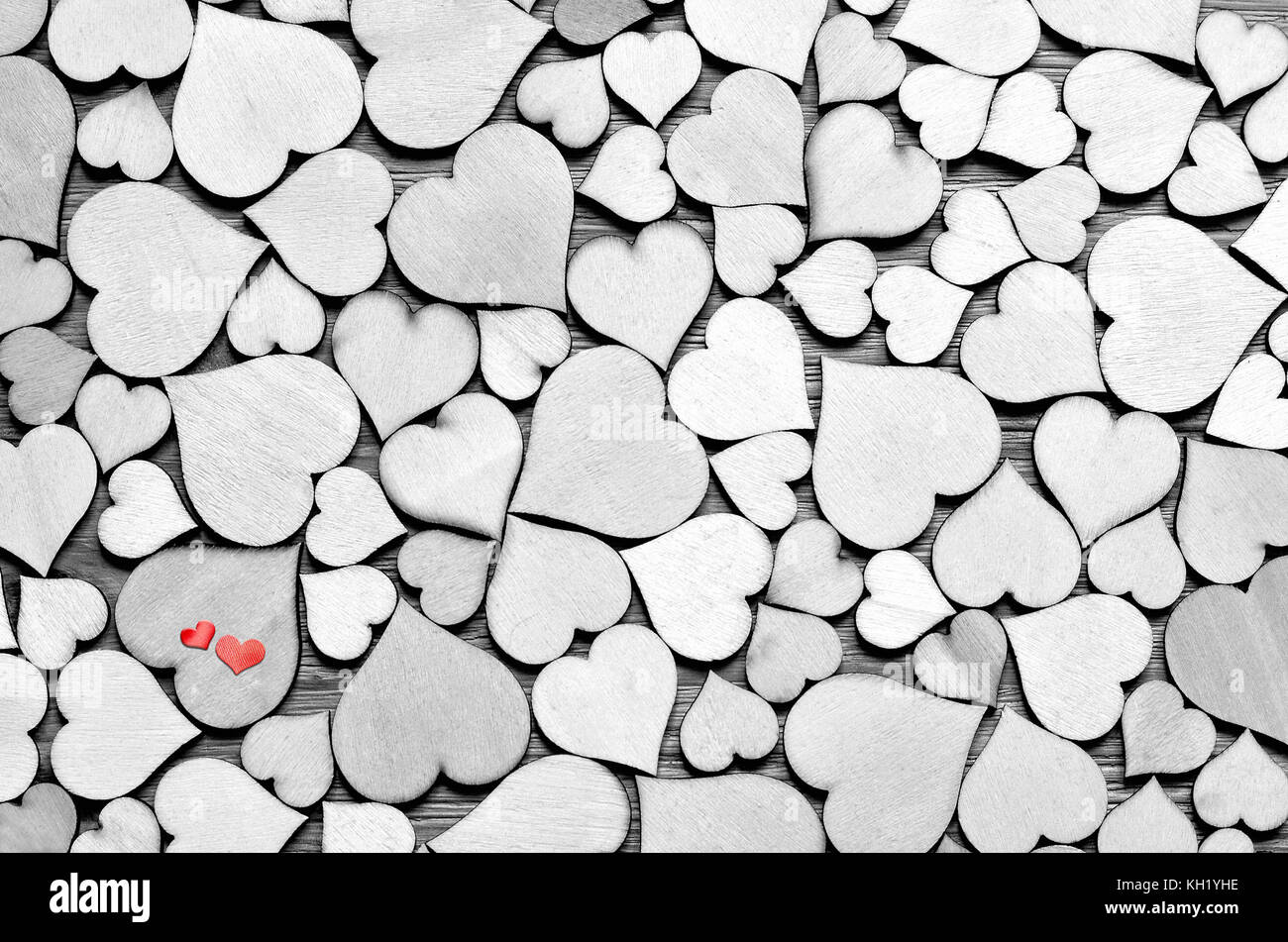 Wooden hearts, small red hearts on the heart background. Valentine day. Stock Photo