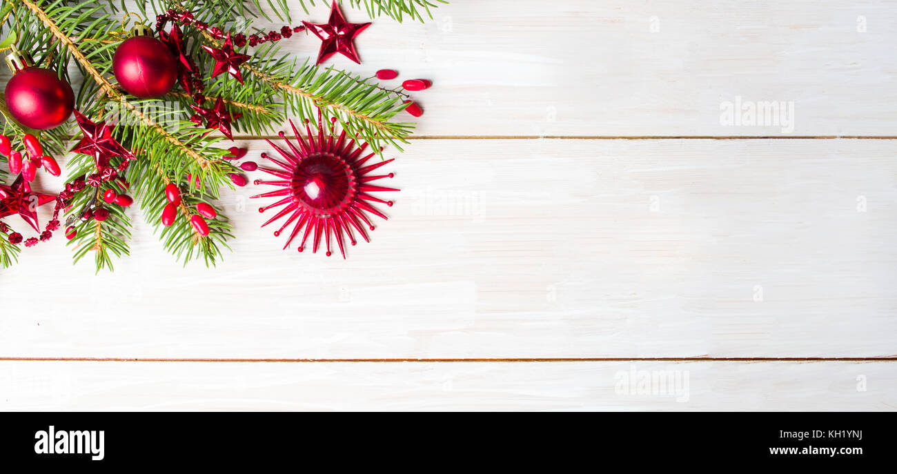 Red Christmas decoration and fir tree with copyspace Stock Photo