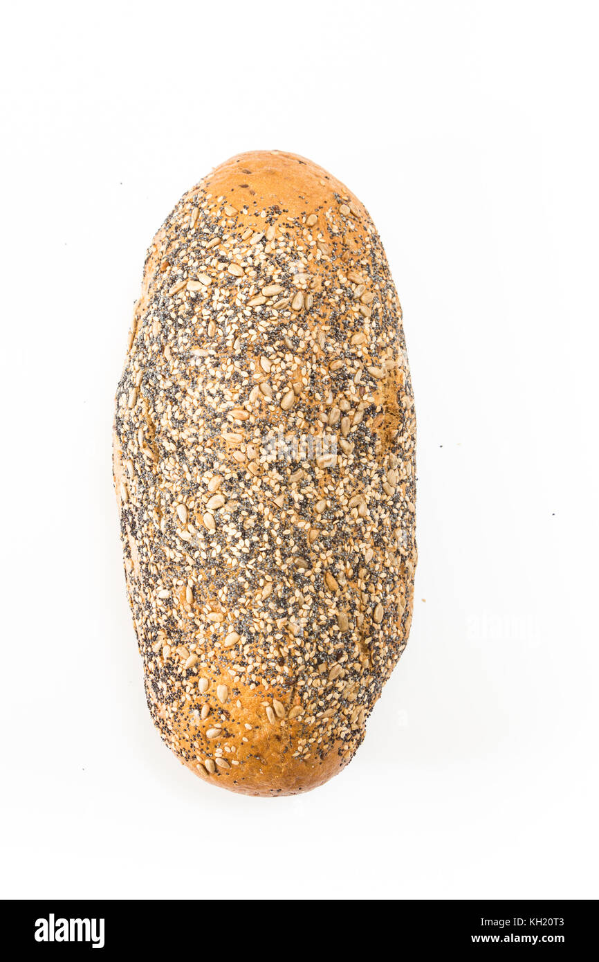 Whole wheat bread with seeds, on white background. Stock Photo