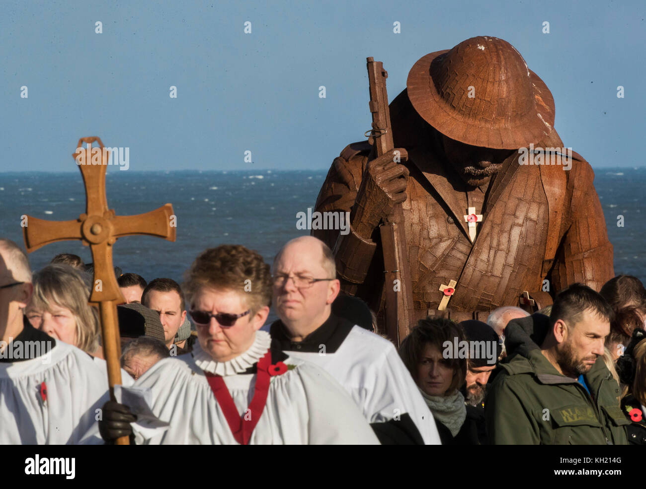A Remembrance Sunday Service in front Tommy, a statue of a First World War soldier by artist&Ecirc;Ray Lonsdale, in Seaham County Durham. Stock Photo