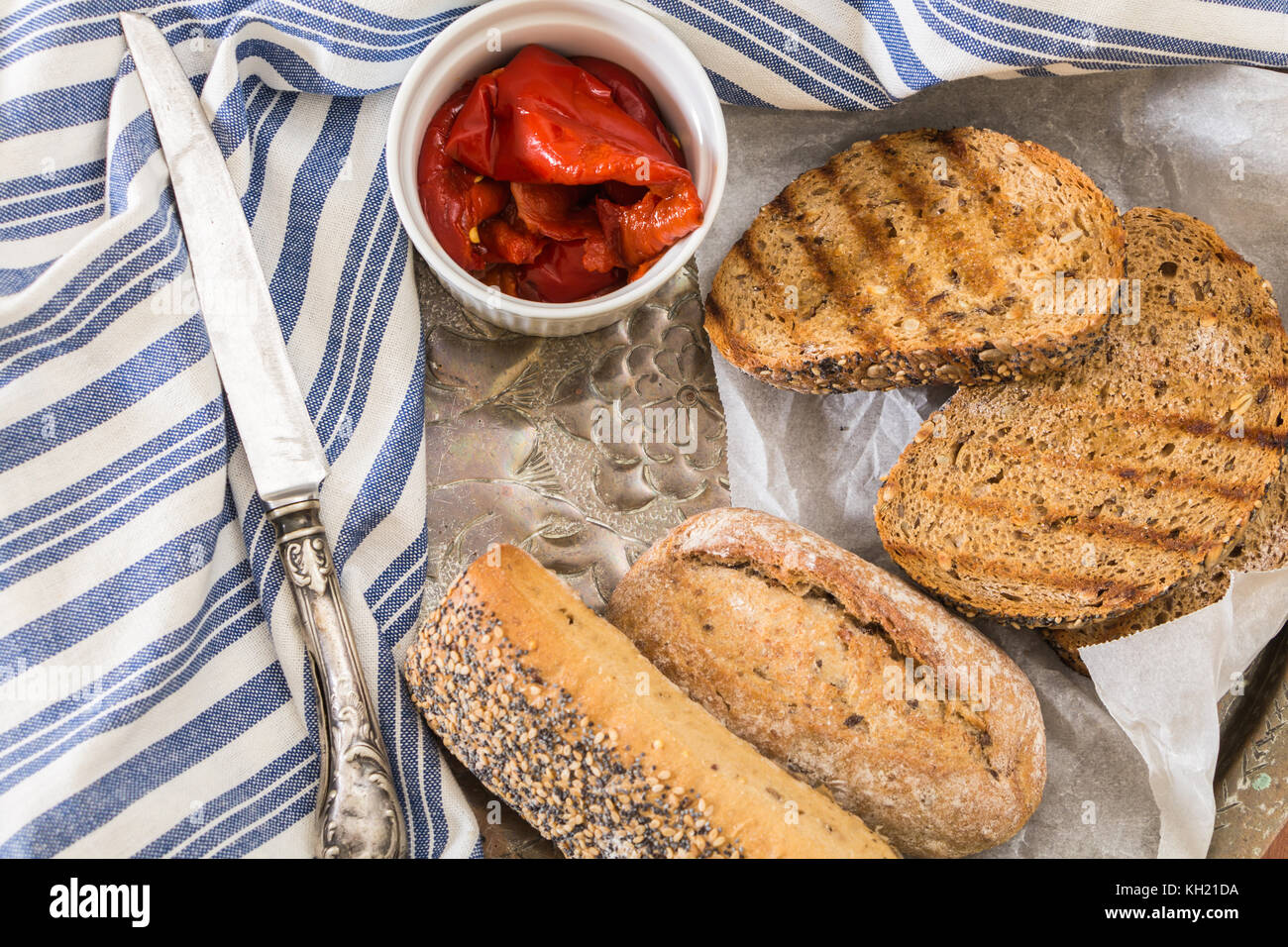 Whole wheat bread buns and grilled bread slices, with roasted red