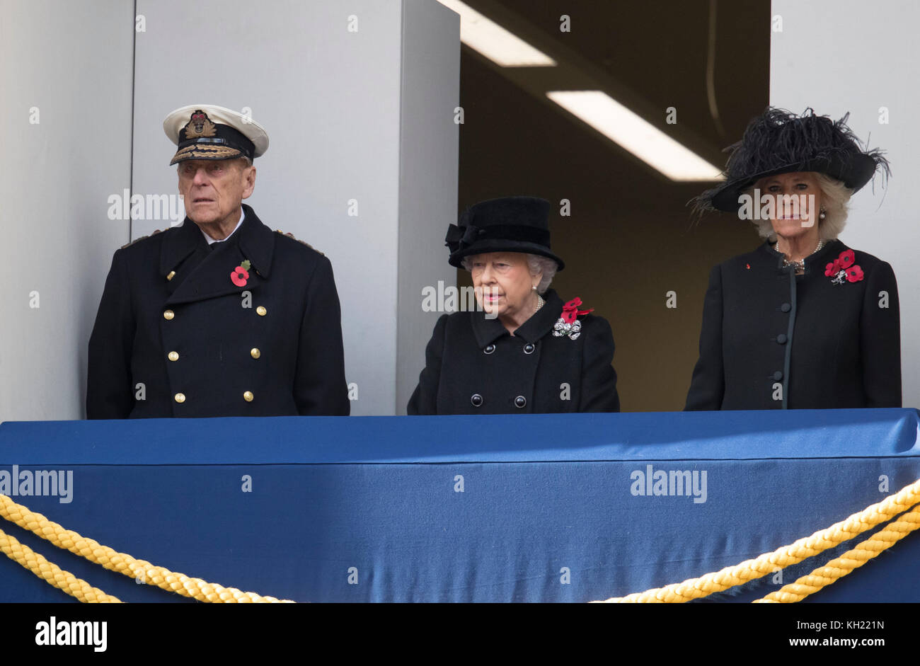 Britain's Queen Elizabeth II stands on the balcony with Britain's Prince Philip, Duke of Edinburgh and Britain's Camilla, Duchess of Cornwall during the Remembrance Sunday ceremony at the Cenotaph on Whitehall in central London, on November 12, 2017. Services are held annually across Commonwealth countries during Remembrance Day to commemorate servicemen and women who have fallen in the line of duty since World War I. Stock Photo