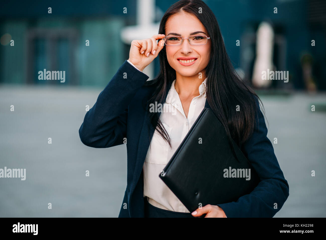 Young business woman in glasses and suit Stock Photo - Alamy