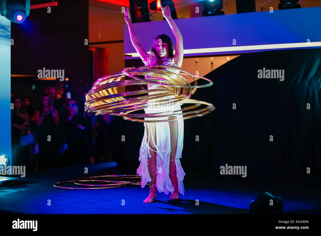 Hula hoop dancer performing in a ceremony Stock Photo