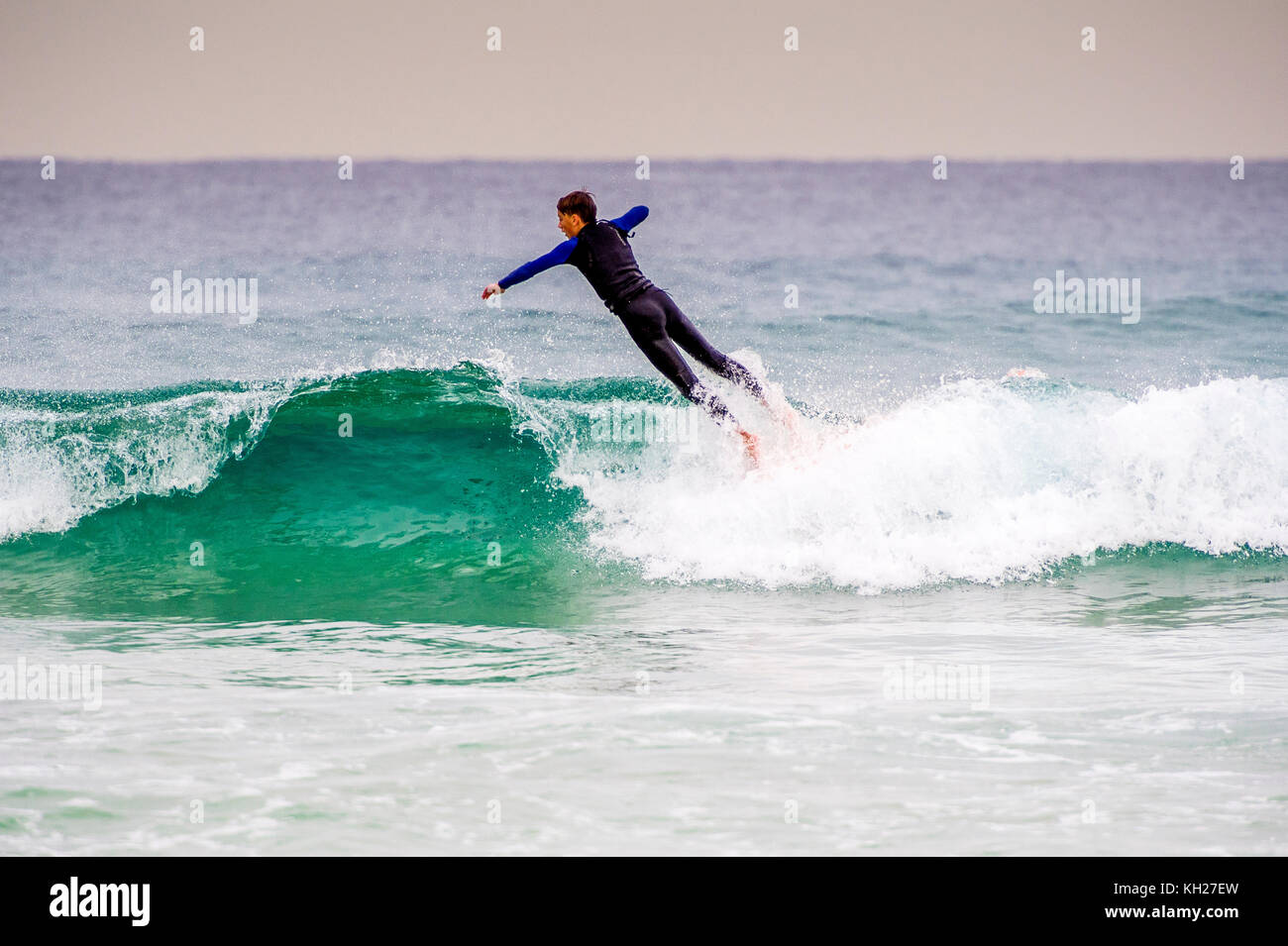 A surfer wipes out at Bondi Beach, Sydney, NSW, Australia Stock Photo